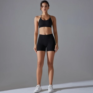 Detail of black high-stretch seamless sports bra and shorts set for yoga and fitness