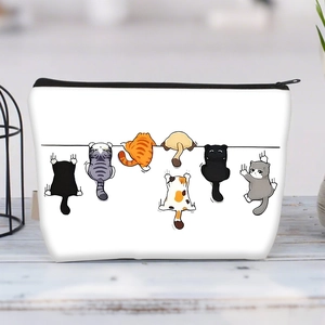 Large white canvas makeup bag featuring cute cartoon cats climbing a line with black zipper