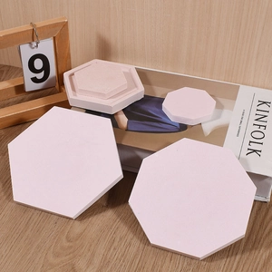 Detailed close-up of pink geometric resin coaster molds in hexagonal and octagonal shapes
