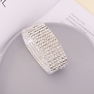 Sparkling multi-row rhinestone bracelet in silver finish on a minimalist grey tray