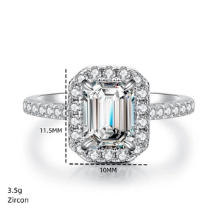 Detailed view of emerald cut zircon ring with 11.5mm by 10mm halo setting