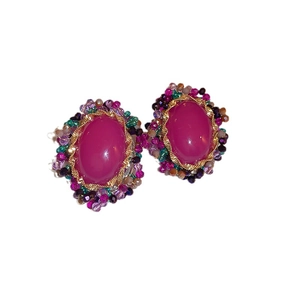 Bohemian style stud earrings featuring fuchsia resin stones and colorful beaded borders