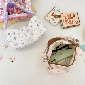 Detail of seersucker pouches with lace trim and cartoon bear patterns for women