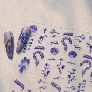 Aurora matte nail stickers featuring purple moon, snake and floral iridescent patterns