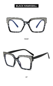 Detail view of black hawksbill glasses frame with glitter decoration and 45-degree angle