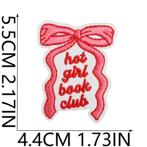 Detail of pink bow embroidery patch with hot girl book club text and size markings