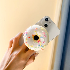 Universal donut shaped phone grip with colorful sprinkles on a white base for desk support