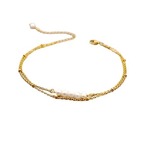 Double-layered golden titanium steel bracelet with natural freshwater pearls for women