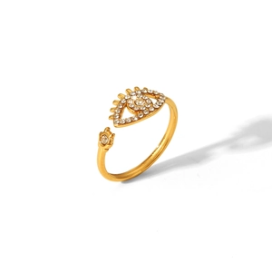 Macro shot of an adjustable evil eye ring with sparkling zircon in gold plated steel