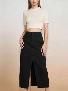 Short-sleeved cream knit top and black denim maxi skirt with front slit for women