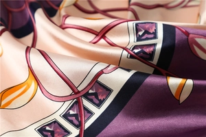 Macro detail of calla lily satin scarf fabric with purple geometric and leaf patterns