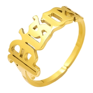 Close-up of 18K gold-plated adjustable ring with Gothic BABY lettering on white background
