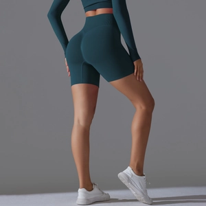 Close-up of seamless teal yoga shorts with high-waist butt-lifting compression texture