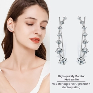 Detail view of S925 silver ear climbers featuring D color moissanite in a sleek row