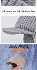 Detail of light gray winter knitted hat with snowflake embroidery and 6cm windproof brim