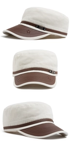 Detail of flat top military cap featuring khaki canvas and dark brown leather brim