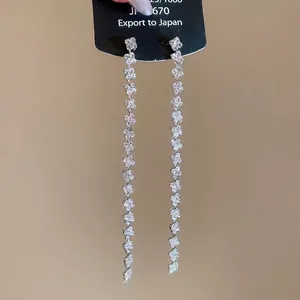 Silver needle square tassel drop earrings with sparkling rhinestones and clover accents