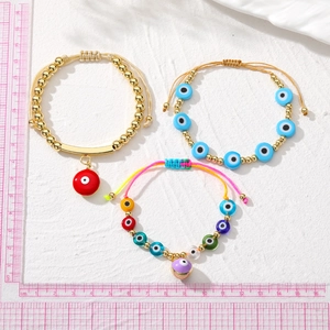 Bohemian evil eye beaded bracelet set with gold plating and colorful handmade details