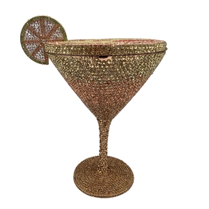 Detailed view of cocktail glass evening bag with champagne crystals and lemon charm