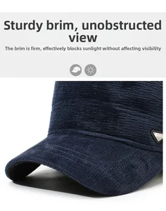 Detailed close-up of navy corduroy cap brim featuring a signature triangle metal logo
