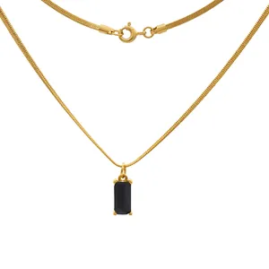Detailed close-up of gold snake chain with a rectangular black gemstone pendant