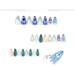 Macro detail of 3D ocean-themed press-on nails with pearls and seashell textures