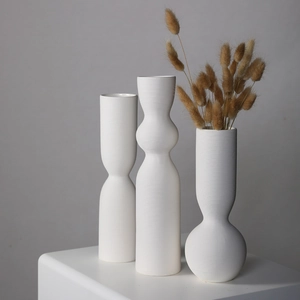 Three-piece minimalist white ceramic vases with ribbed texture for Nordic home decor