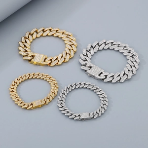 Detail of gold and silver iced-out cuban link bracelets with sparkling rhinestones