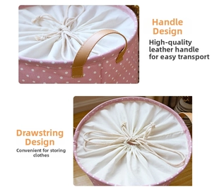 Close-up of pink polka dot cotton linen hamper with PU leather handles and drawstring lid