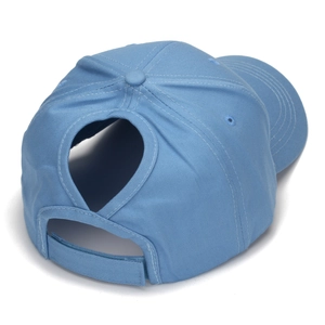 Detail view of the ponytail opening and adjustable velcro strap on light blue cotton cap