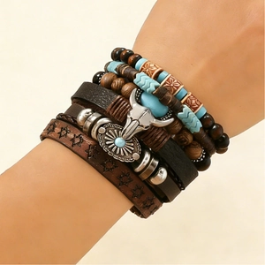 Detail of layered bohemian leather bracelet with turquoise beads and bull head charm