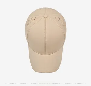Top view of beige quick-dry baseball cap featuring laser-cut ventilation holes for sports