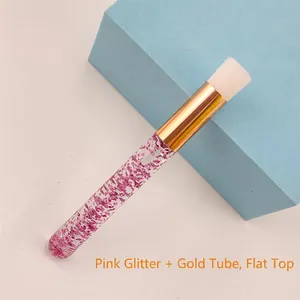 Detail of eyelash cleaning brush with pink sequins in acrylic handle and gold ferrule