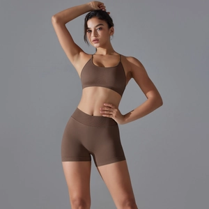 Detail of coffee brown ribbed seamless yoga set featuring racerback bra and high waist shorts