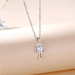 Silver zircon key pendant necklace with delicate O-chain and clear round gemstone