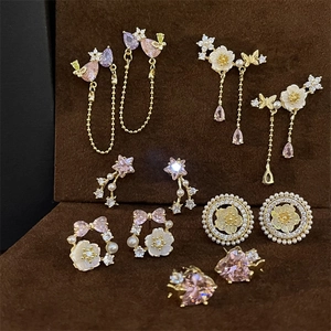 Detailed collection of vintage palace style gold earrings with pink crystals and pearls