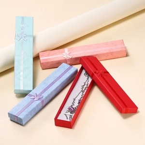 Long textured paper jewelry gift boxes with ribbon bows in four assorted colors