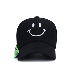 Classic black baseball cap with white embroidered smile face and green decorative side label