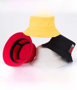 Detail showing colorful cotton canvas bucket hats with seamless brims in various shades