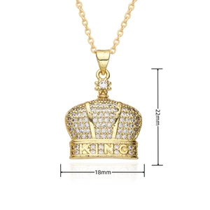 Detail of gold crown pendant with cubic zirconia and KING engraving, 22mm by 18mm