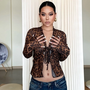 Detail of sheer mesh tie-front leopard print top with long sleeves in brown tones