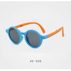 Detail view of foldable blue and orange kids round sunglasses at 45 degree angle