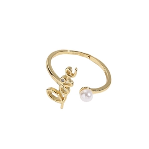 Adjustable gold love zircon pearl ring with elegant script lettering on white background