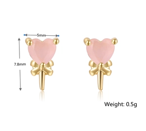 Macro detail of 5mm pink heart stud earrings with golden bow base and size specs