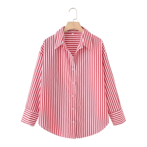 Detail of red and white vertical striped long-sleeved shirt with classic lapel and cuffs
