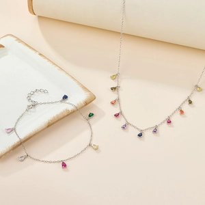 Detail view of S925 silver necklace and bracelet set with colorful teardrop zirconia