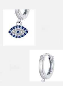 Detail of 925 sterling silver evil eye hoop earrings with blue and white zircons