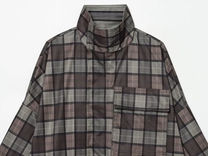 Detailed view of high立collar and woven plaid texture on a brown checkered coat