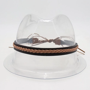 Detail of woven leather hat band in brown and tan with adjustable tie on a white background