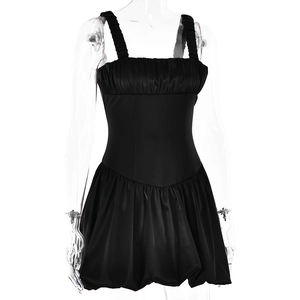 Detail of a black square-neck mini dress with ruched bodice and backless design